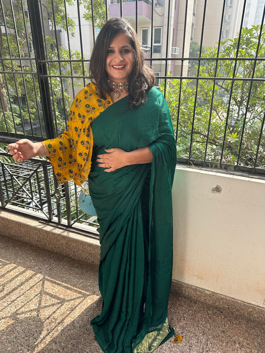 Bottle green solid modal silk sari with zari border
