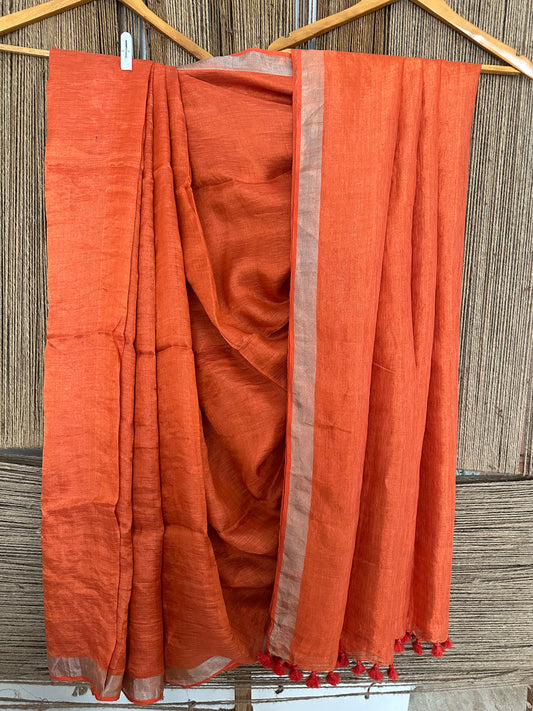 Marmalade orange silver metallic linen sari with woven border and tassels