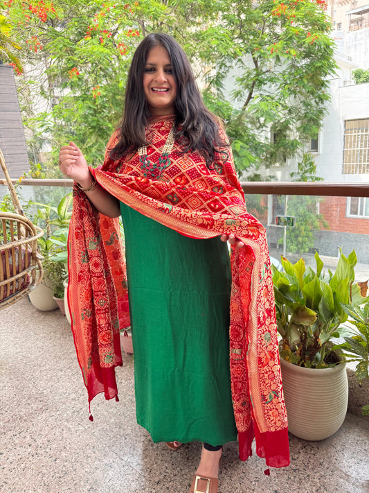 Red shade handwoven bareek bandhani meena kari jaal in premium georgette kurta set with bottle green gajji dupatta