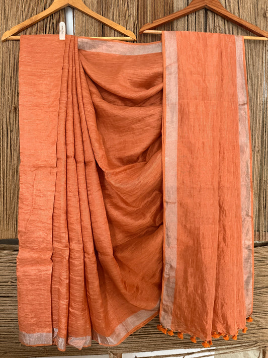 Coral orange silver metallic linen sari with woven  border and tassels