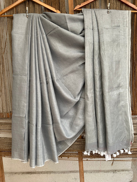 Silver tissue linen zari sari with woven yellow border &amp;  tassels