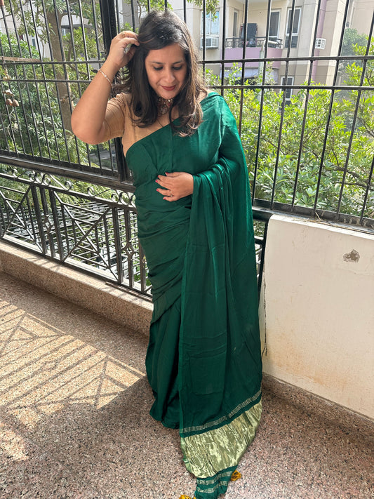 Bottle green solid modal silk sari with zari border