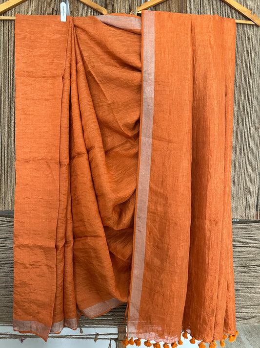 Tangerine orange copper metallic linen sari with woven  border and tassels