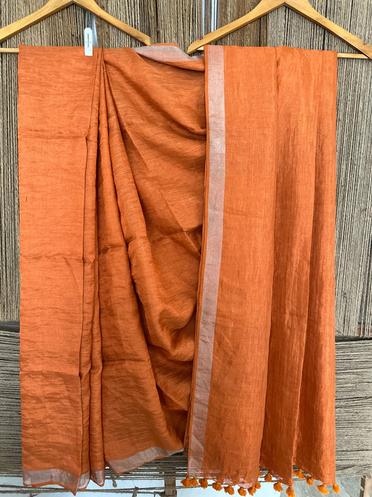 Tangerine orange copper metallic linen sari with woven  border and tassels
