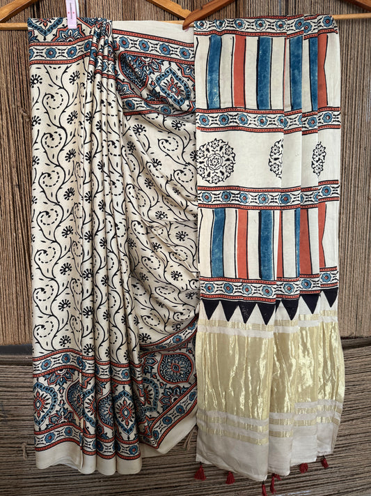 Beige ajrakh modal silk sari with zari pallu