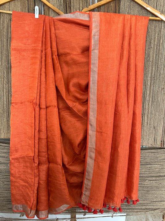 Marmalade orange silver metallic linen sari with woven  border and tassels