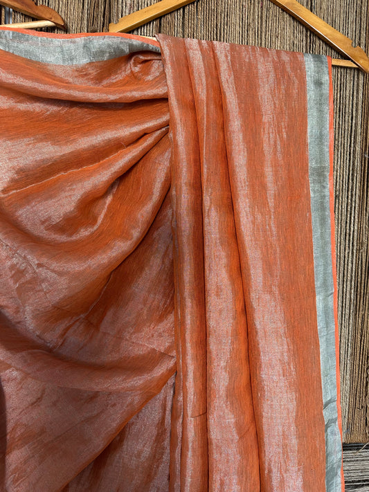 Rust orange metallic linen sari with woven  border and tassels