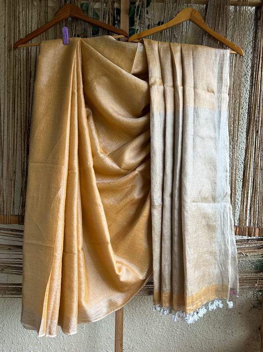 Golden linen zari sari with woven white border &amp;  tassels