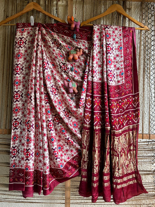 Maroon cream modal silk patola print sari with zari border pms- 1012